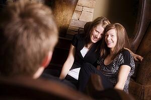 Two young women smiling