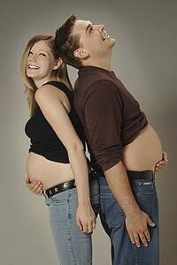 A couple with growing bellies