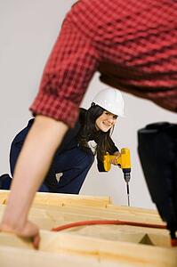 Carpenters working with power tools