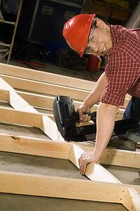 Content carpenter working with power tool