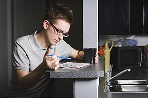 Man working on crossword
