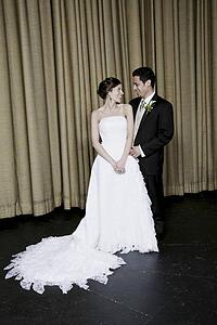 Bride and groom smiling at each other