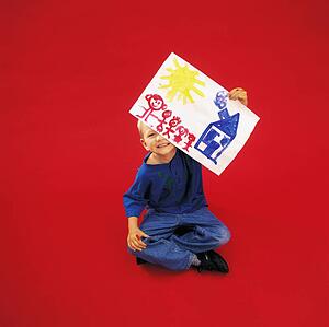 A boy holding painting