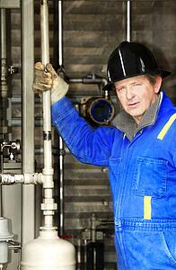 Industrial worker with oilfield equipment