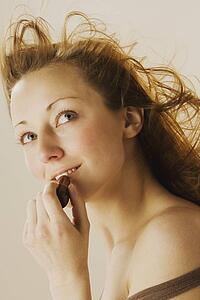 Woman applying lipstick