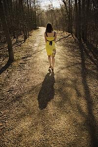 Young woman walking on a path