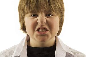 Young boy making silly face