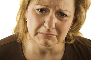 Middle aged woman looking sad