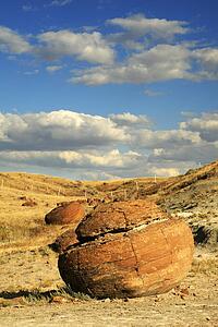 Round rock and cloudy sky at Red Rock Coulee 