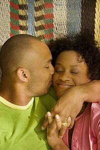 Husband kissing wife