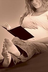 A pregnant woman reading the Bible