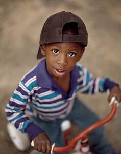 Boy riding a tricycle