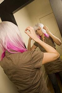 Woman getting ready in front of mirror