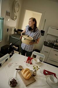 Woman in the kitchen on the phone