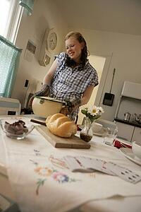 Woman in the kitchen on the phone