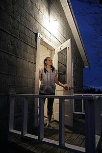 A woman standing at door
