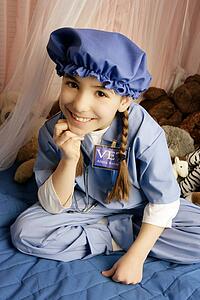 Girl smiling on bed