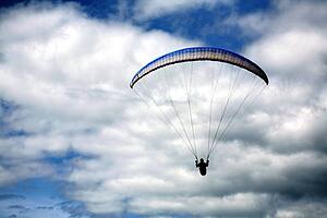 A hang glider on a cloudy day