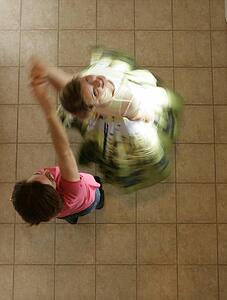Mother and daughter dancing