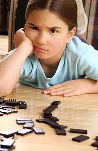 Girl playing dominoes