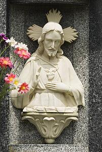 Carved stone image of Christ in niche, Northern Spain 