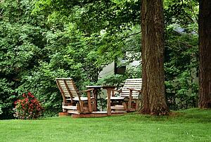 Wooden chairs set up in a yard