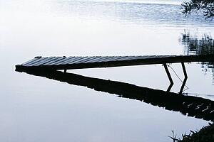 Pier sloping into the lake