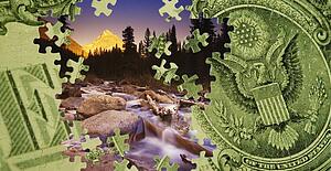 Composite of a US dollar bill and a mountain scene