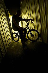 Person on a bike in a metal building