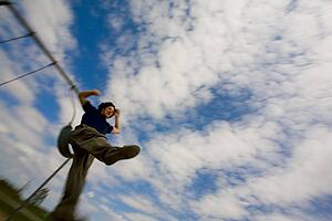 Person jumping off a swing