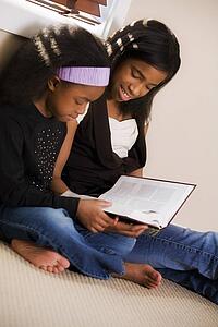 Sisters reading the Bible