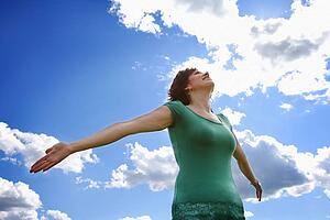 Woman with arms outstretched