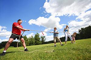 Tug of war between dad and kids