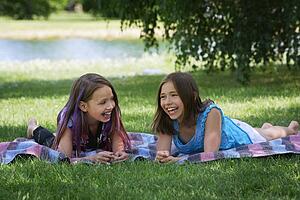 Two girls laughing together