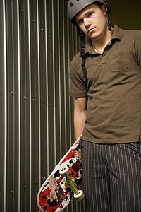 Guy holding a skateboard