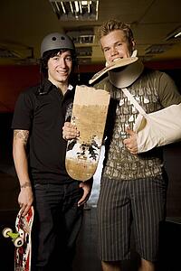 Two skateboarders together