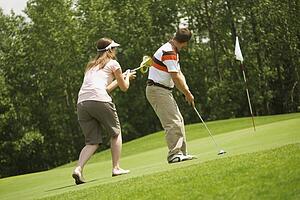 Couple golfing together