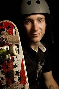 Studio shot of a man with a skateboard