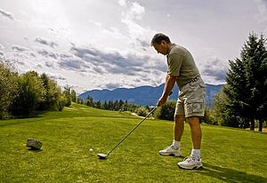 Golfer taking his first shot
