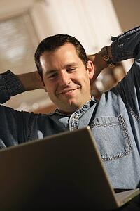 Man sitting with laptop computer