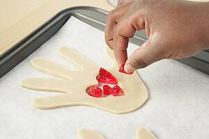 Person garnishing food