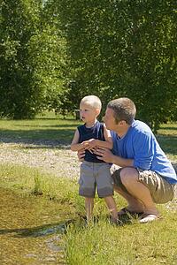 Man with his son in a park