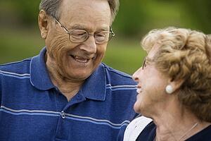 Senior couple looking at each other while smiling