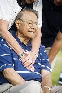Front view of senior man sitting