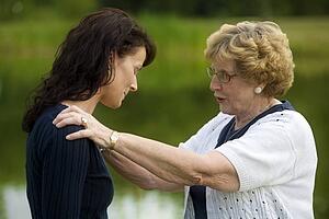 Senior woman consoling her daughter