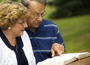Senior couple reading the Bible