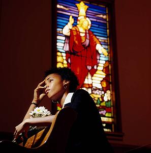 A sad woman in a church