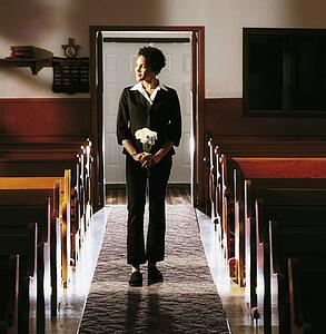 Front view of a woman standing in church