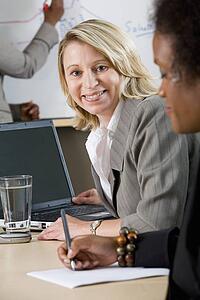 Side view of businesswoman smiling