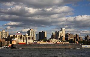Barge passing Brooklyn Heights viewed from Lower Manhattan, New York City, New York, USA 